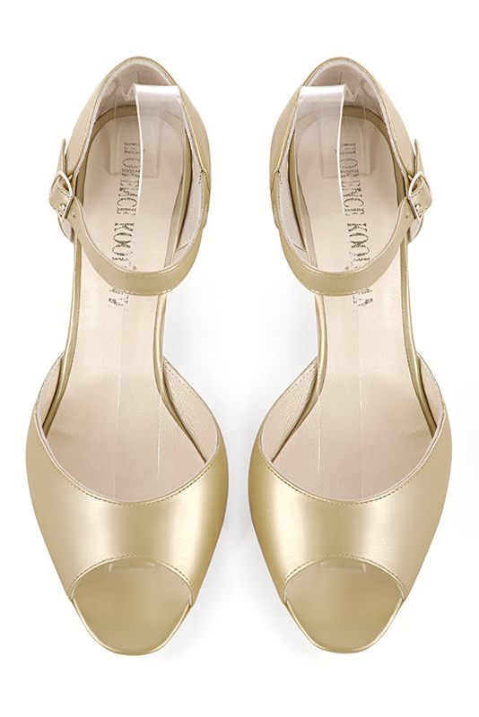 Gold women's closed back sandals, with an instep strap. Round toe. Medium comma heels. Top view - Florence KOOIJMAN